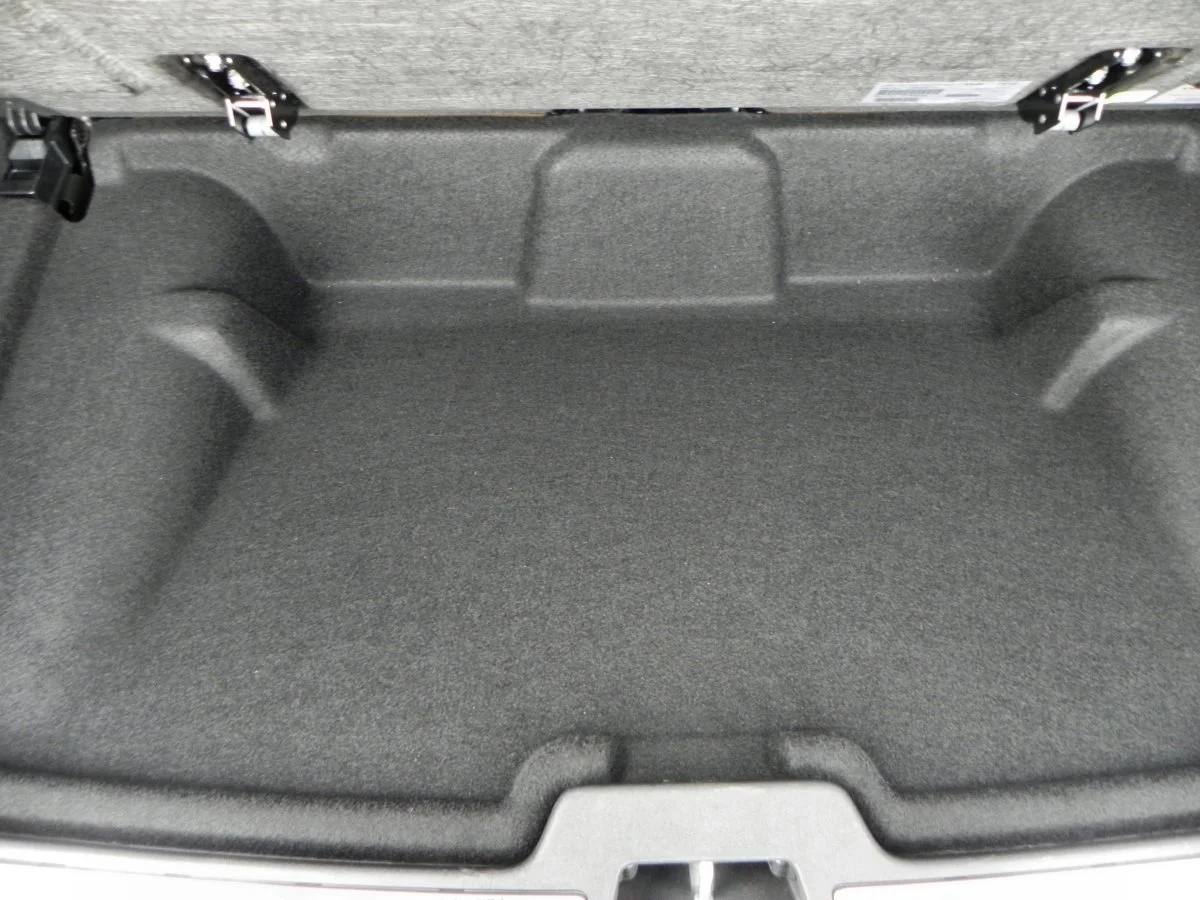 In some models, there is a small area under the cargo cover where valuables can be stashed