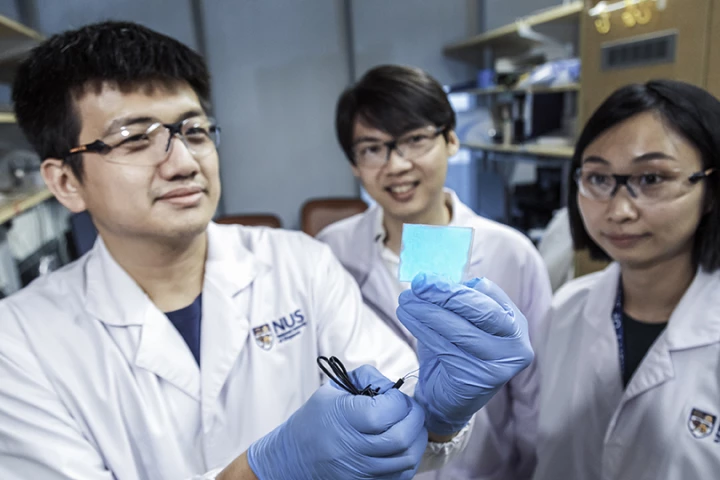 Asst. Prof. Benjamin Tee (center), with team members Mr. Wang Guanxiang (left) and Dr. Tan Yu Jun (right)