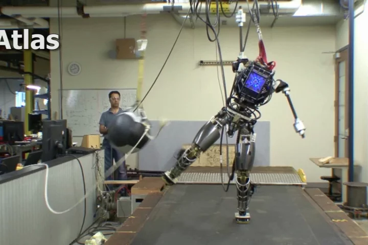 An incomplete version of the ATLAS robot maintains its balance even when hit with a 20 lb ball