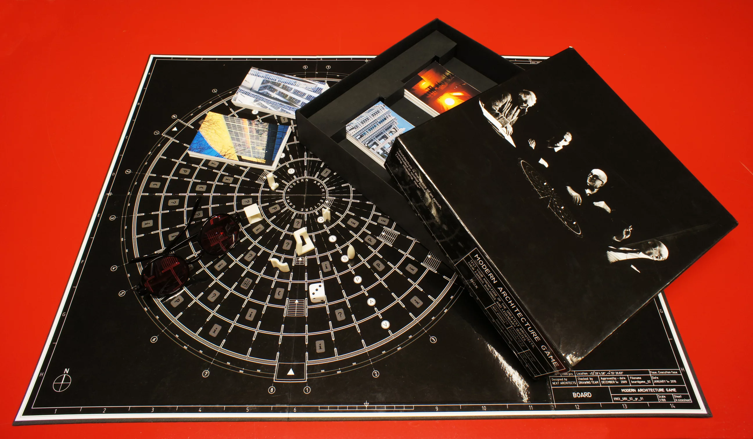 The box and contents of the Modern Architecture Boardgame