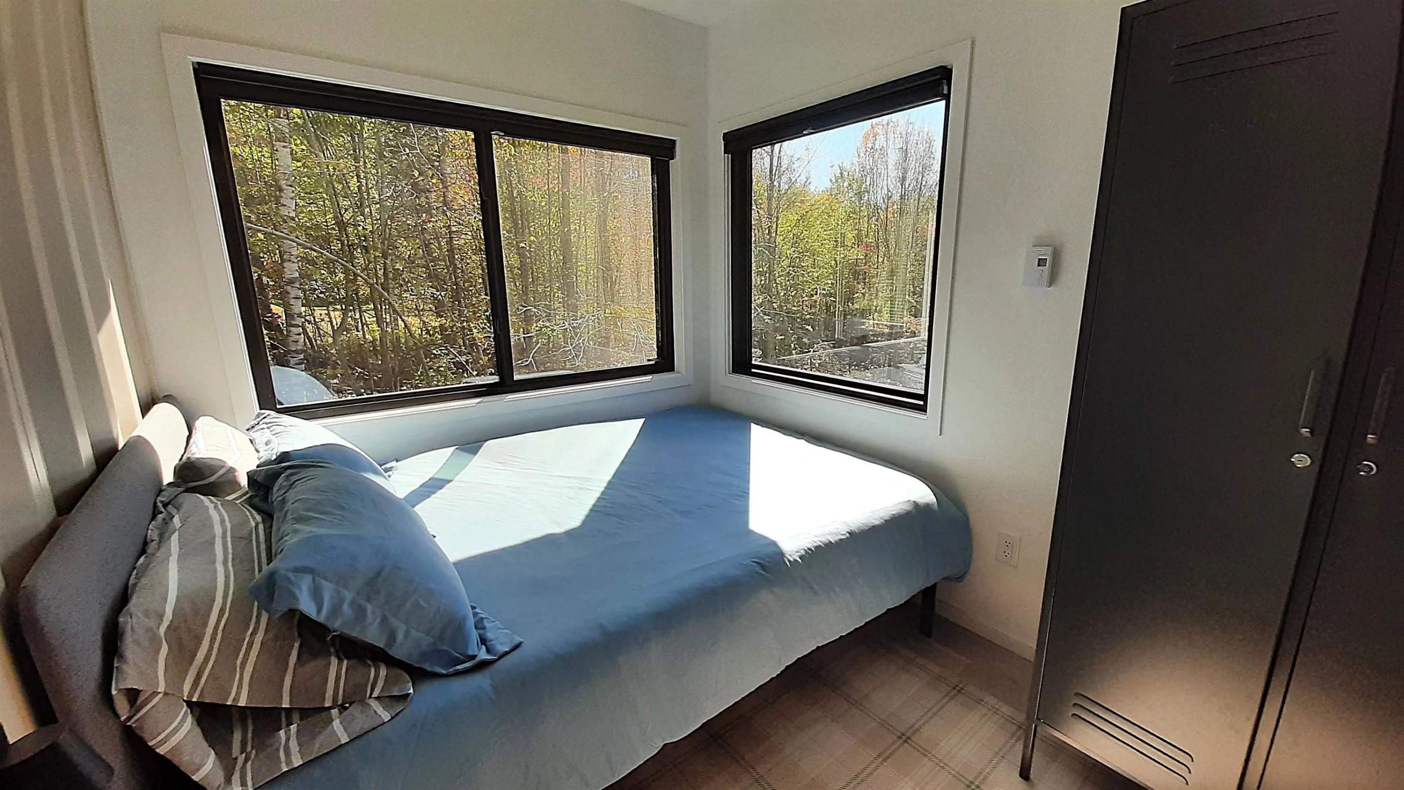 The Vermont Villa's main bedroom is compact but includes a double bed and storage space