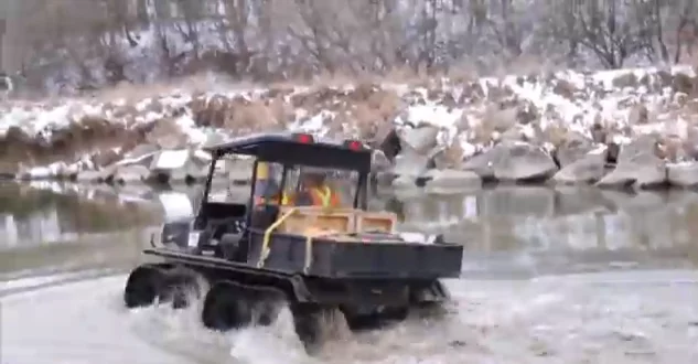The XTI makes its way across a river