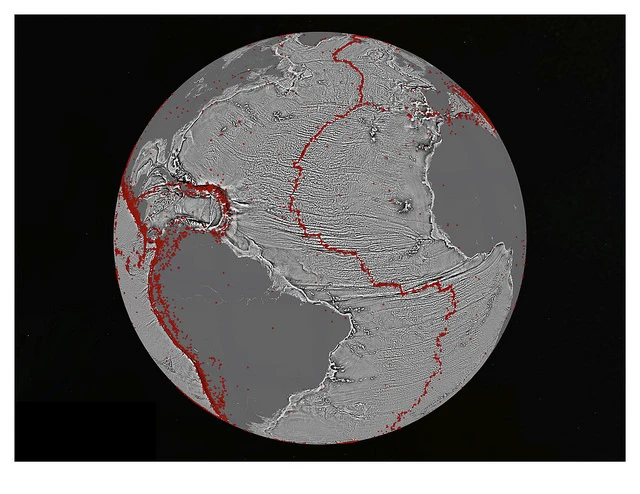 A gravity gradient model of the North Atlantic with red dots showing locations of earthquakes with magnitude above 5.5 and highlighting the present-day location of the seafloor spreading ridges and transform faults (Image: David Sandwell, Scripps Institution of Oceanography, UC San Diego)