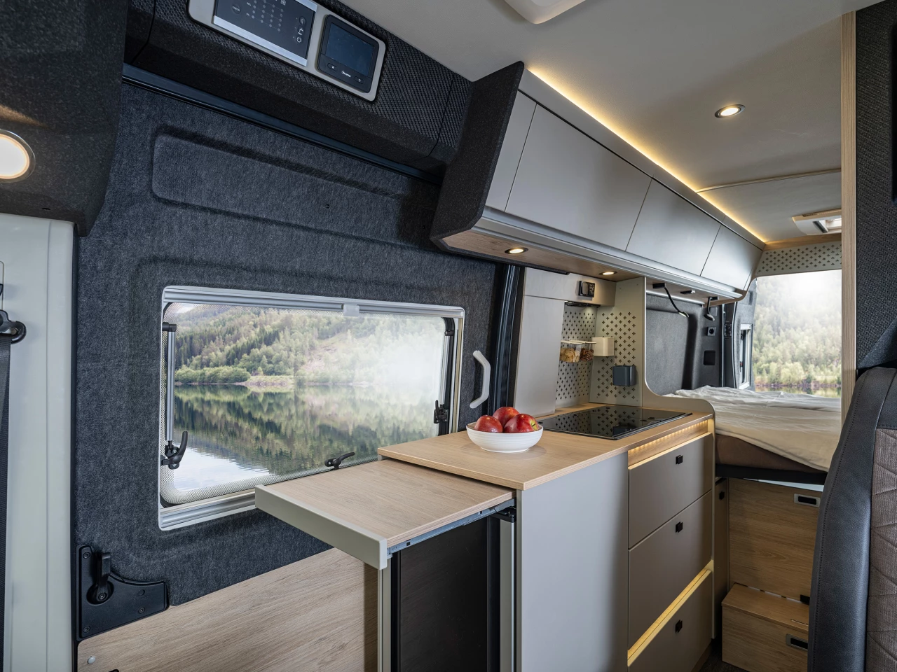 Instead of folding, the countertop extension slides out at the push of a button