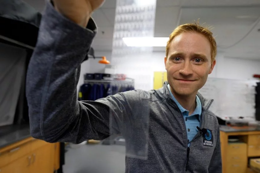 Assoc. Prof. Michael Bartlett with a piece of his craftily cut tape