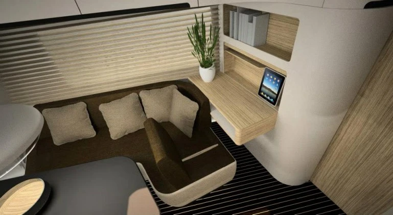 The Caravisio interior shows a side table/desk with convertible cushion backrest
