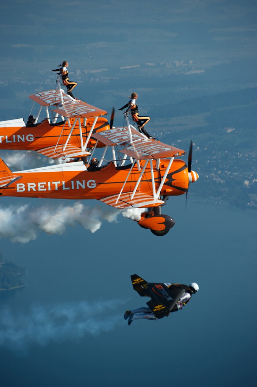 Yves "Jetman" Rossy flies in formation alongside the Breitling Wingwalkers