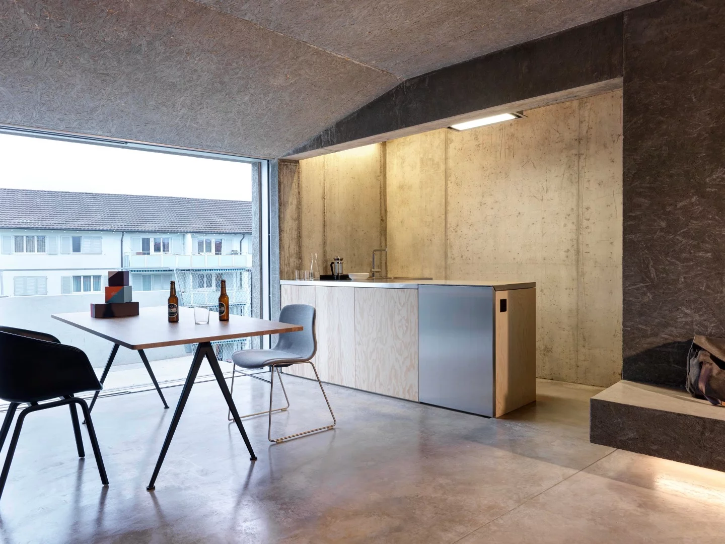 Affordable Housing Langgrütstrasse's interior decor is enlivened with wood