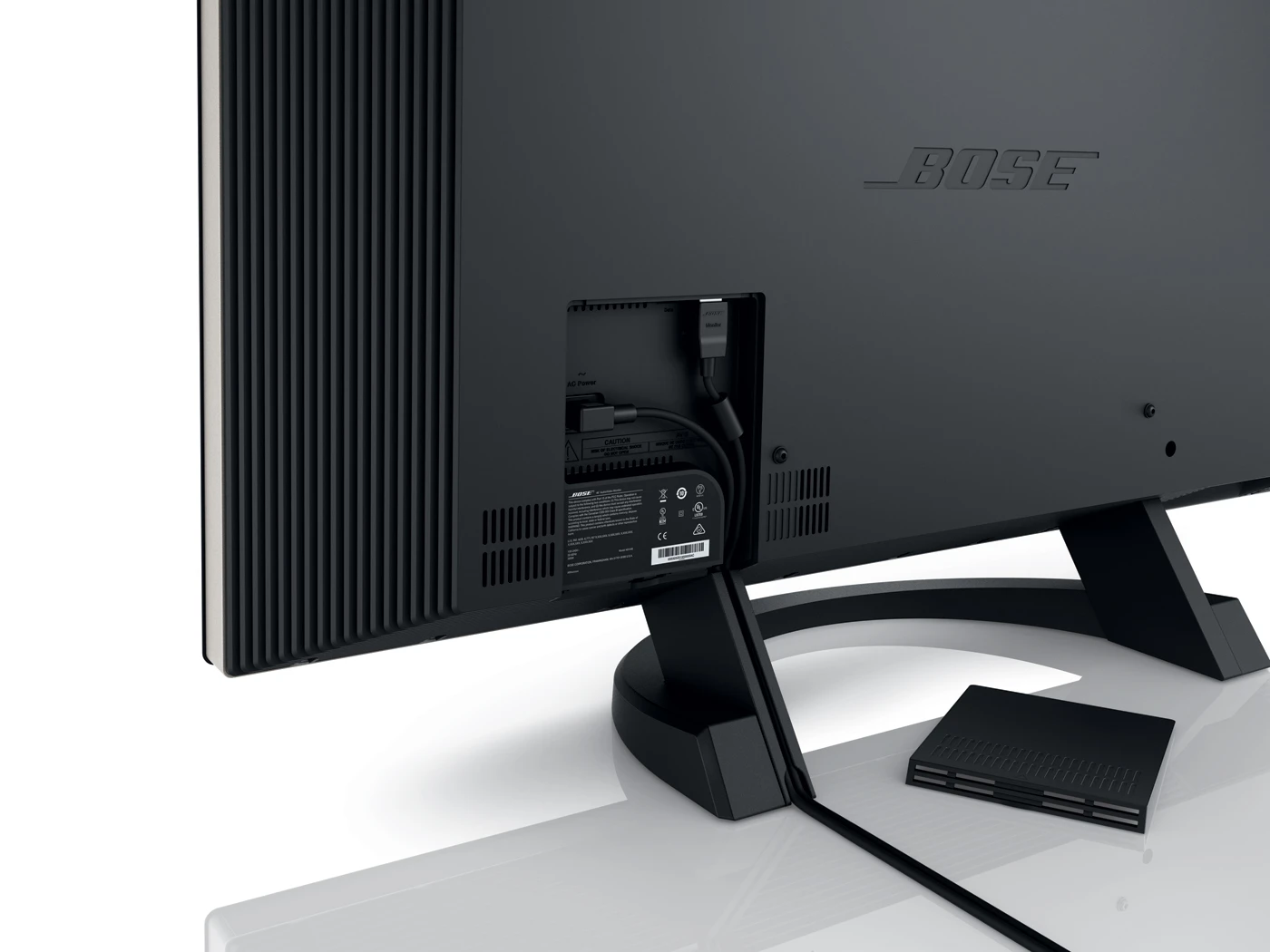 The display is connected to the console by a single cable