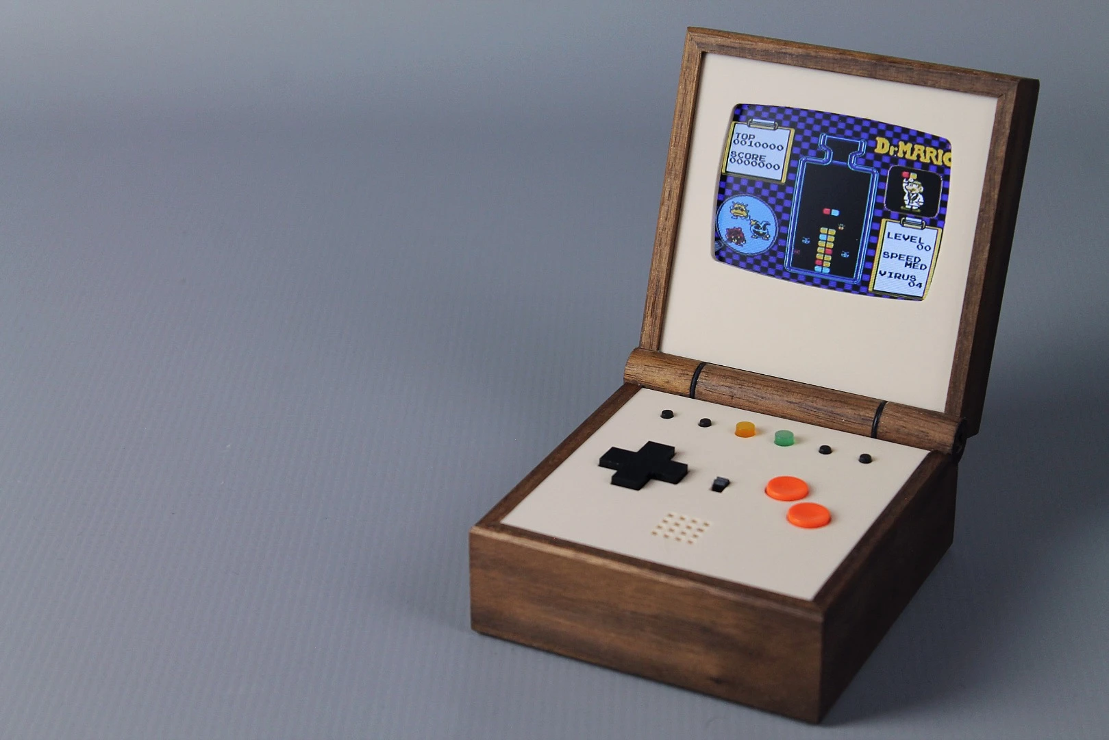 The Pixel Vision: A Game Boy replica fitted into a wooden box that can flip open
