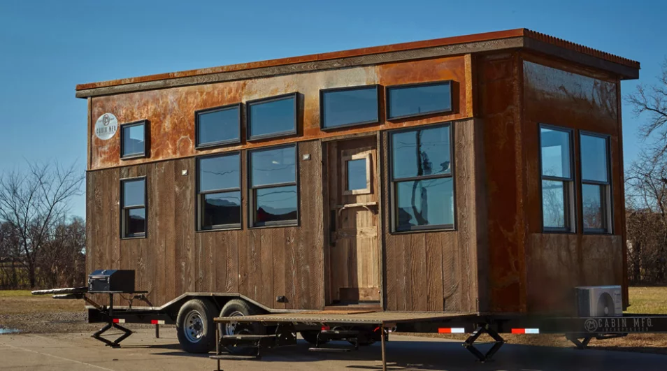 The tiny hunting cabin measures 8.6 x by 24 ft (2.62 x 7.3 m)