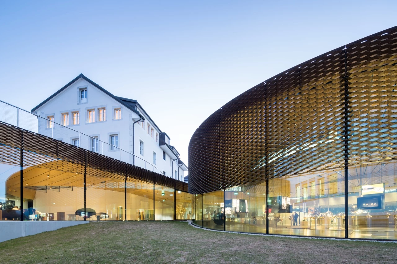 Musée Atelier Audemars Piguet's exterior has a brass mesh screen attached to provide shading inside