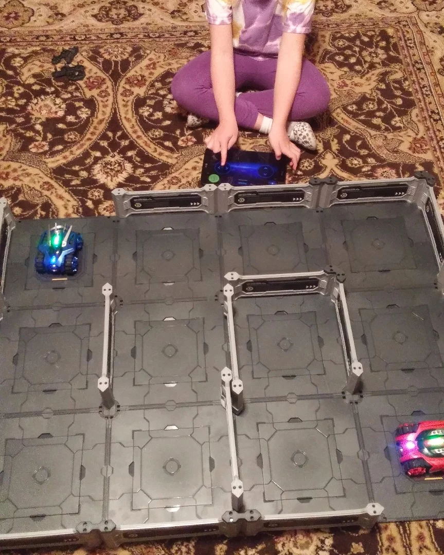 Here the Zega tanks are fully loaded and ready for battle. The author's daughter works the controller for one of the tanks