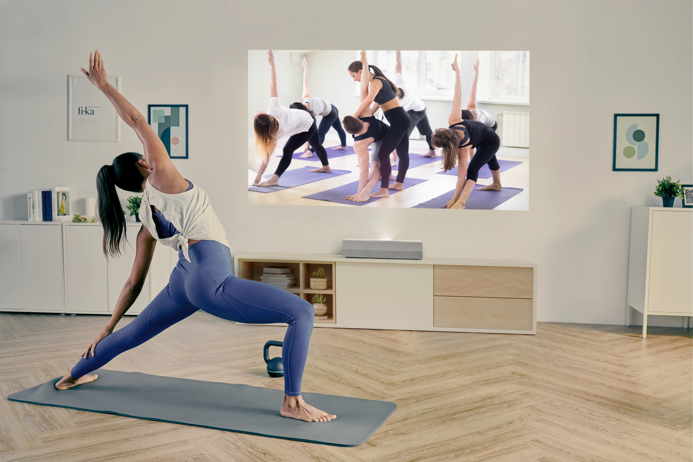 The CinemaX P2 can mirror content from a smartphone, such as a streamed yoga lesson