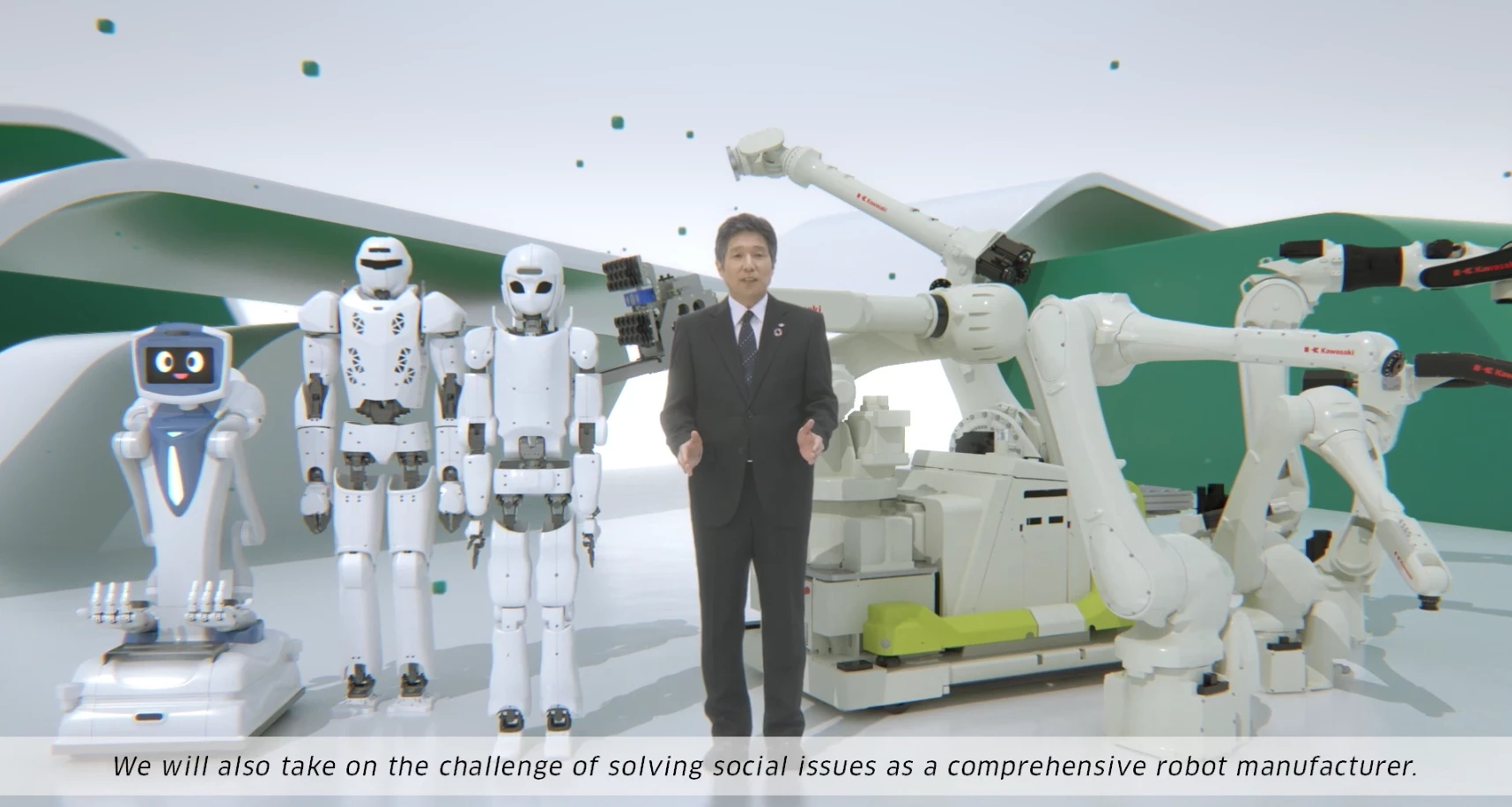 Noboru Takagi, Executive Officer General Manager of Robot Division, Precision Machinery and Robot Company, Kawasaki Heavy Industries, Ltd. with some robots.