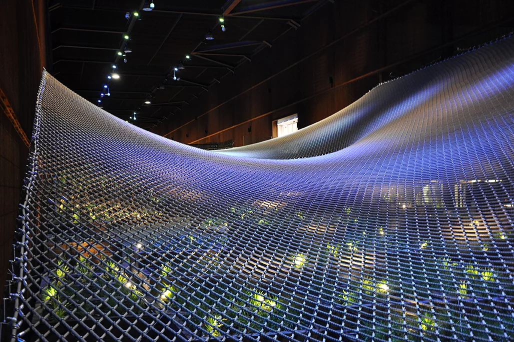 The Brazilian Pavilion features massive trampolines hovering above garden beds