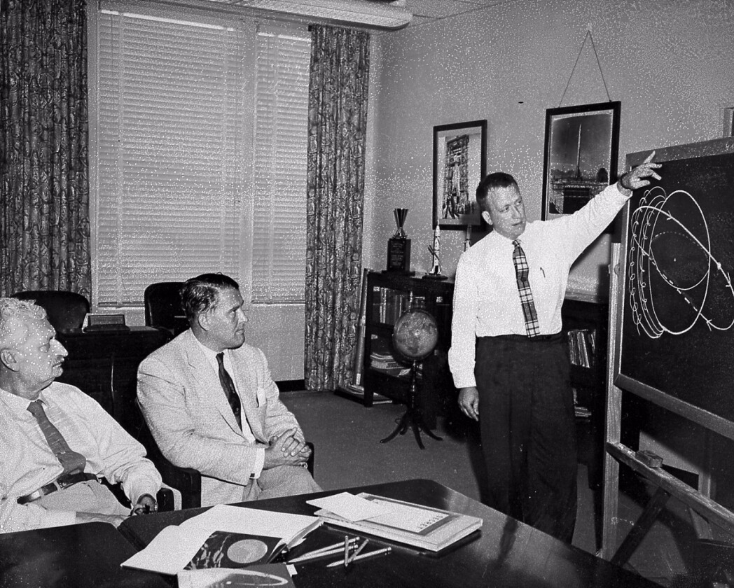 Wernher Von Braun and Hermann Oberth studying orbital trajectories