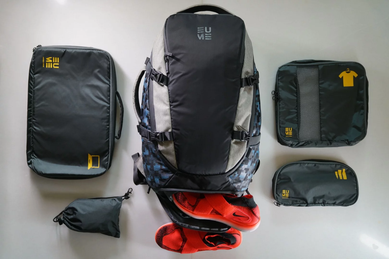 The 42 liter capacity Eume Travel backpack comes with a digital sleeve, a laptop sleeve, a toiletries pouch and a hidden shoe compartment