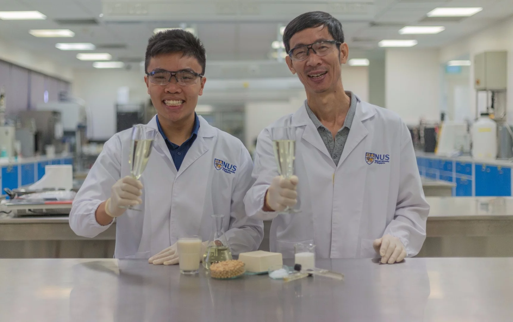 Associate Professor Liu Shao Quan (right) and PhD student Mr. Chua Jian Yong (left) with glasses of Sachi