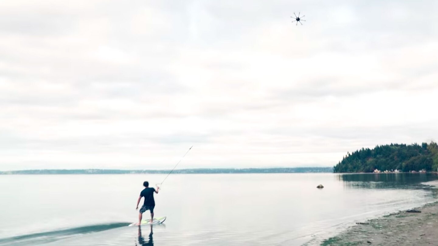 The rider manages to maintain a decent speed being pulled by the drone