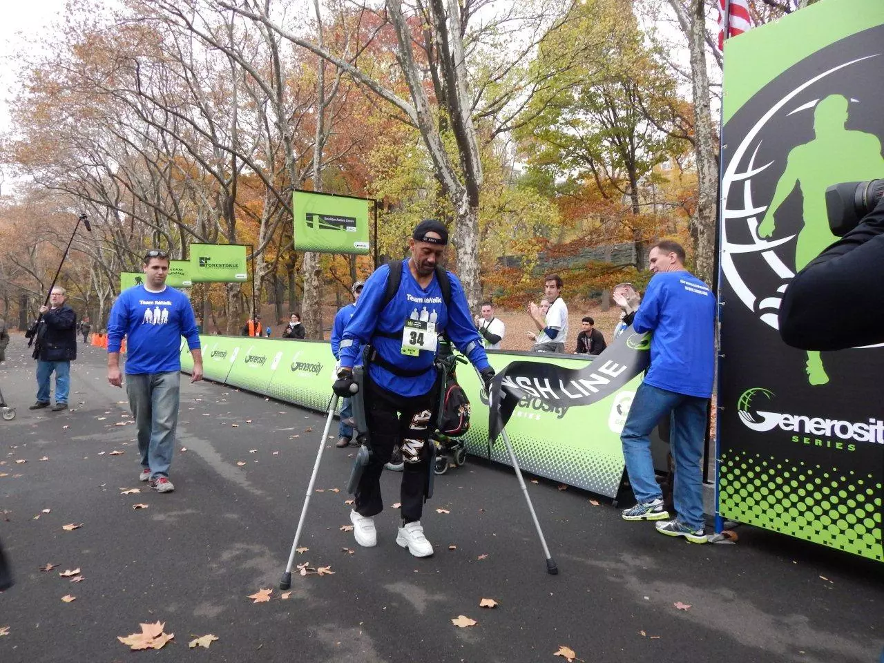 "ReWalker" Gene Laureano crosses the finish line at the Generosity NYC 5K