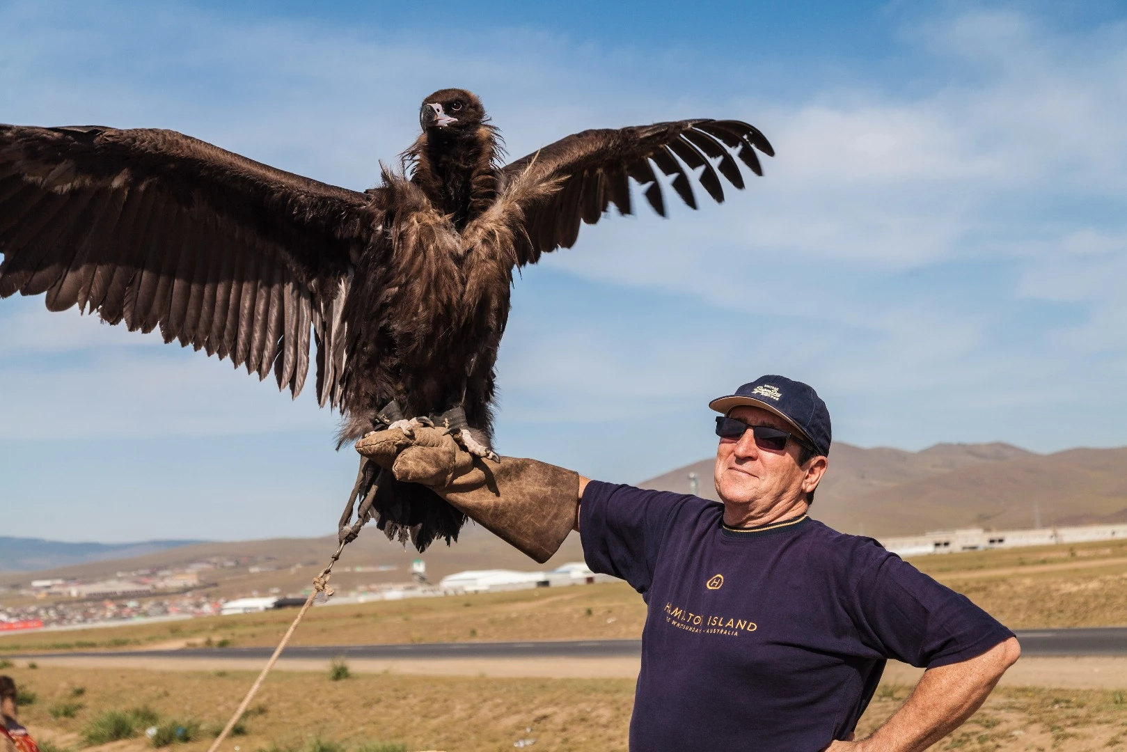 Howard Hall with a trained hunting eagle, outside Ulaanbaatar
