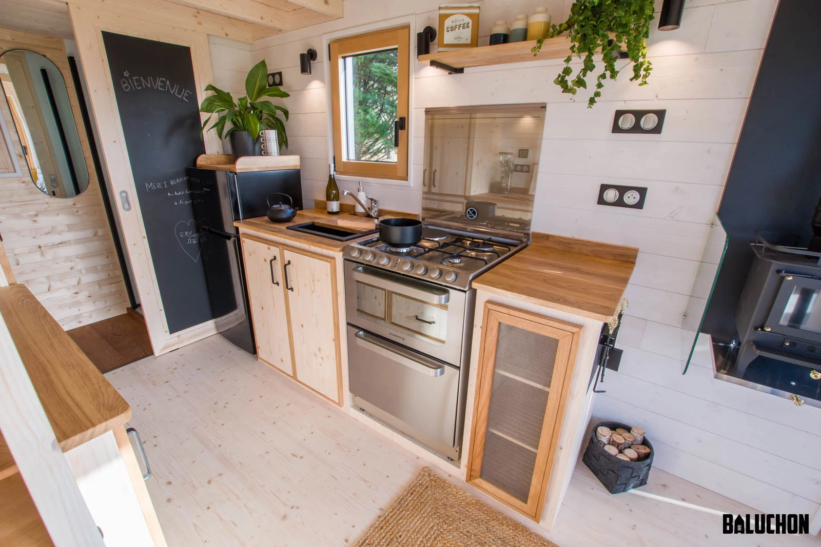The Ræv's kitchen is well-stocked for a French model and even includes a dishwasher, as well as an oven, four-burner propane-powered stove, sink, fridge, and cabinetry