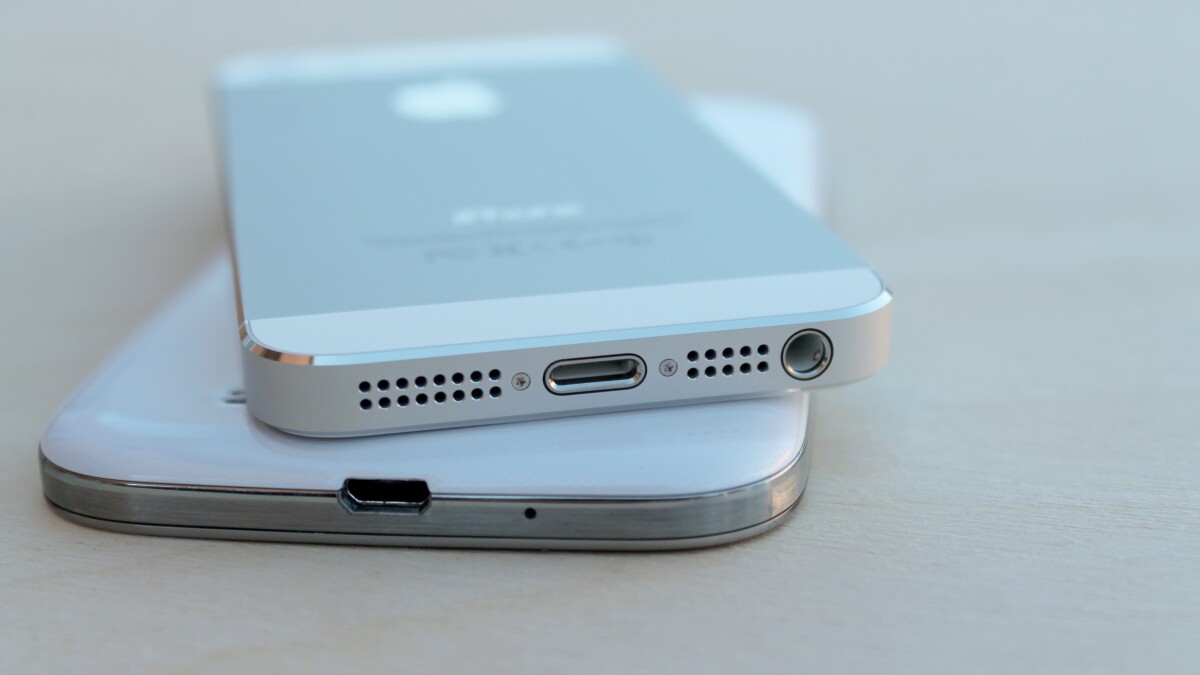 The iPhone 5s charges via Apple's proprietary Lightning connector, while the GS4 charges via microUSB