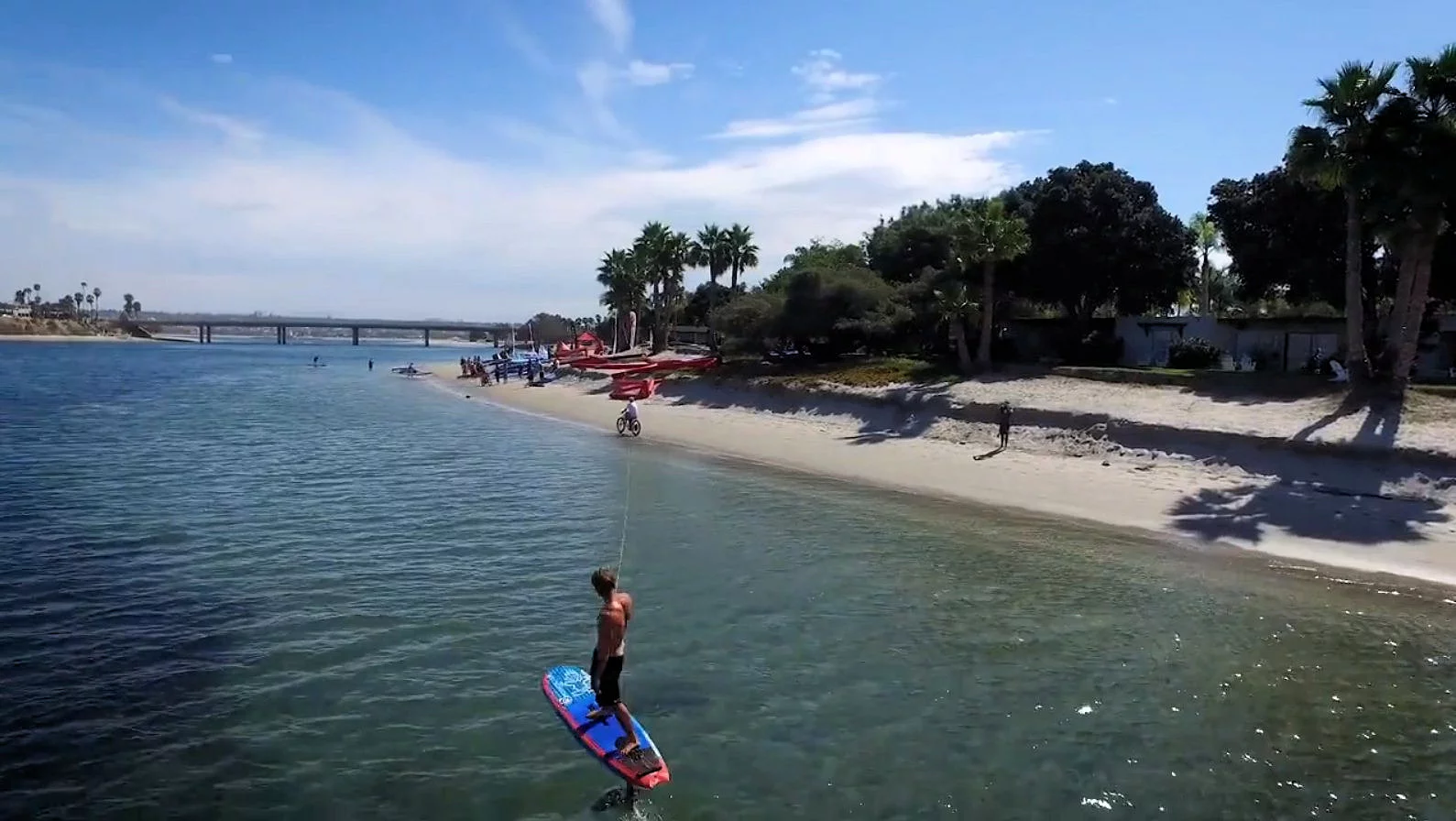 The Cruzer e-bike being used to pull a hydro-board along the coastline