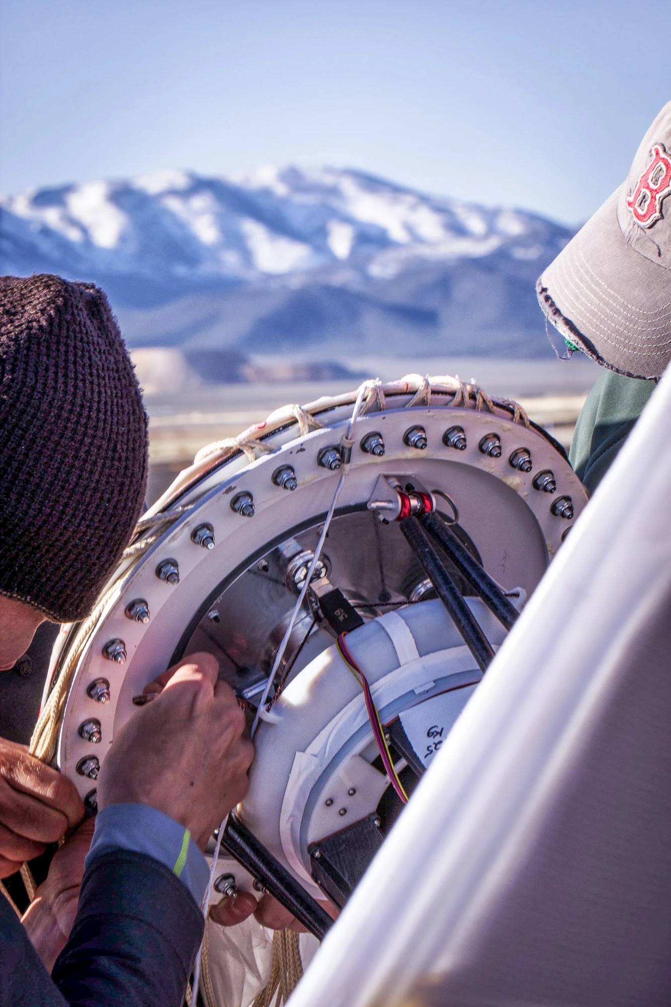 The balloon carries a box of electronics beneath it, which contains radio antennas to communicate with the ground and other balloons, GPS, flight sensors, instruments to monitor weather conditions, and the necessary circuit boards for controlling the whole system