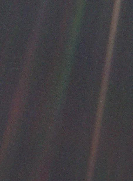 Earth at a distance of more than four billion miles. Earth is the dot in the middle of the bright streak (Image: NASA/JPL)