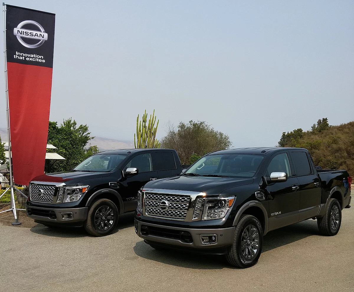 2017 Titan XD trucks parked under a Nissan flag at a winery in central California