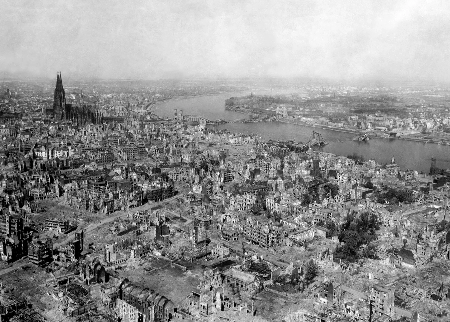 Cologne Cathedral stands seemingly undamaged while entire area surrounding it is completely devastated after Allied bombing raids