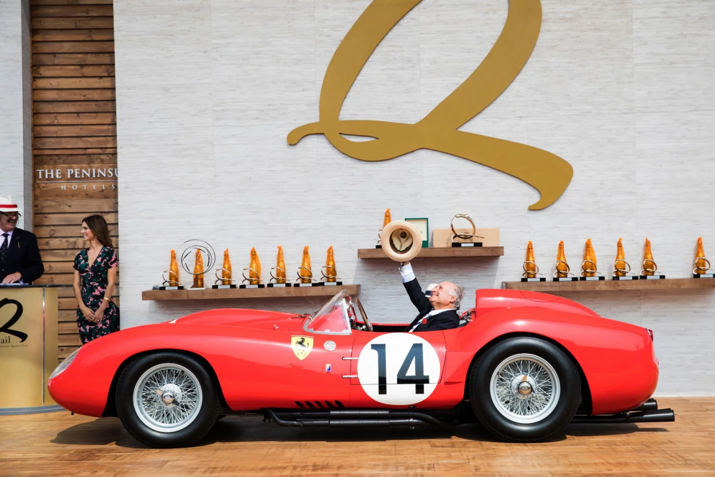 The car seen here with custodian Sir Michael Kadoorie saying thanks to the powers that be, is Ferrari 250 Testa Rossa #0728TR, the car which won the 1958 24 Hours of Le Mans in the hands of Phil Hill and Olivier Gendebien. Originally sent from the factory to the North American Ferrari distributor, Luigi Chinetti, this one-of-twenty Ferrari 250 TR has a spectacular in-period racing history, having finished third in the 1958 Targa Floria with Mike Hawthorn and Wolfgang von Trips driving, then fifth in the 1958 1000 km Nurburgring race with Wolfgang Seidel and Gino Munaron behind the wheel.