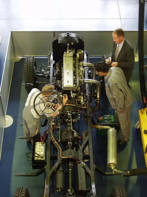 Craftsmen going about their work on this rare vehicle.