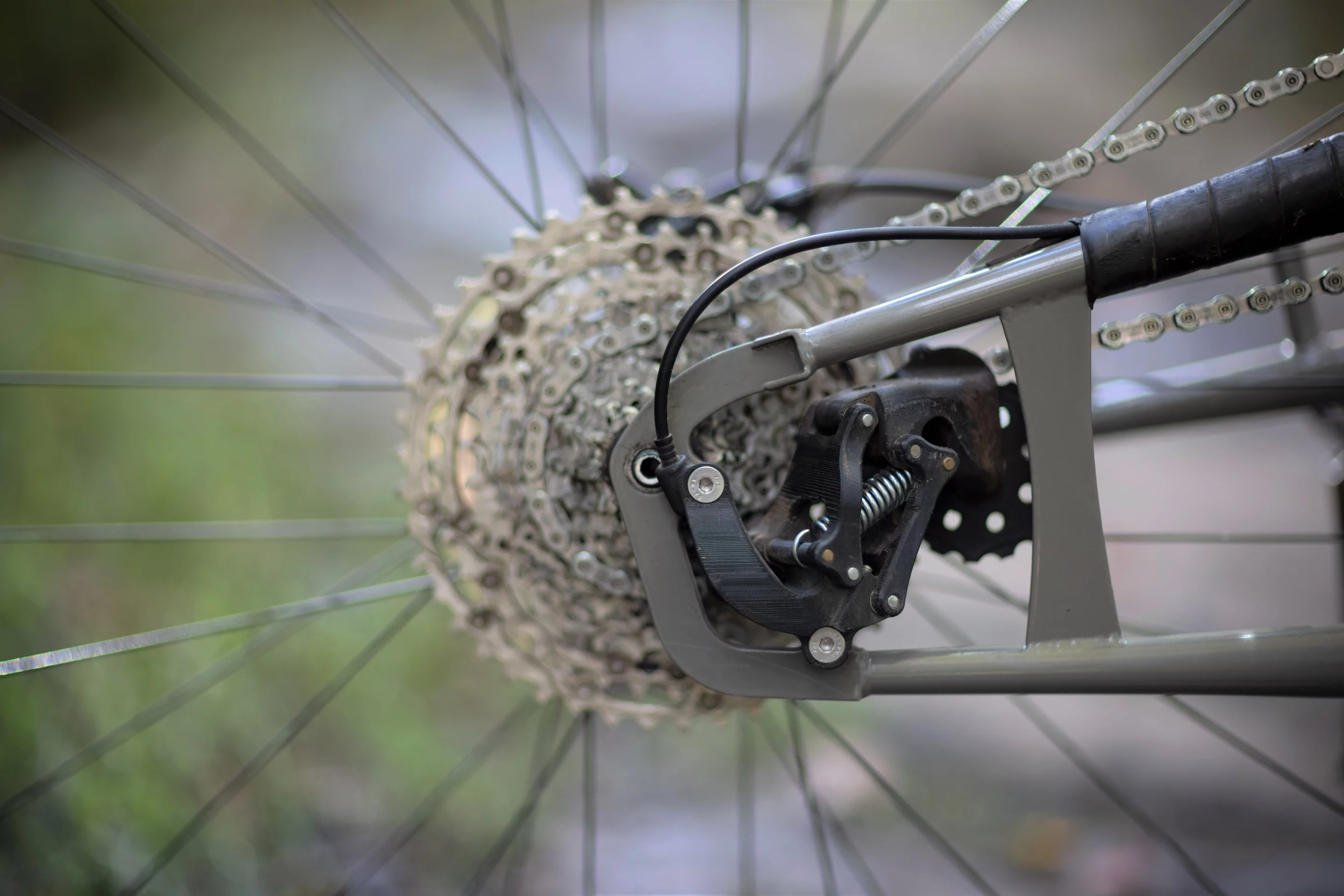 The swingarm frame helps to protect the derailleur