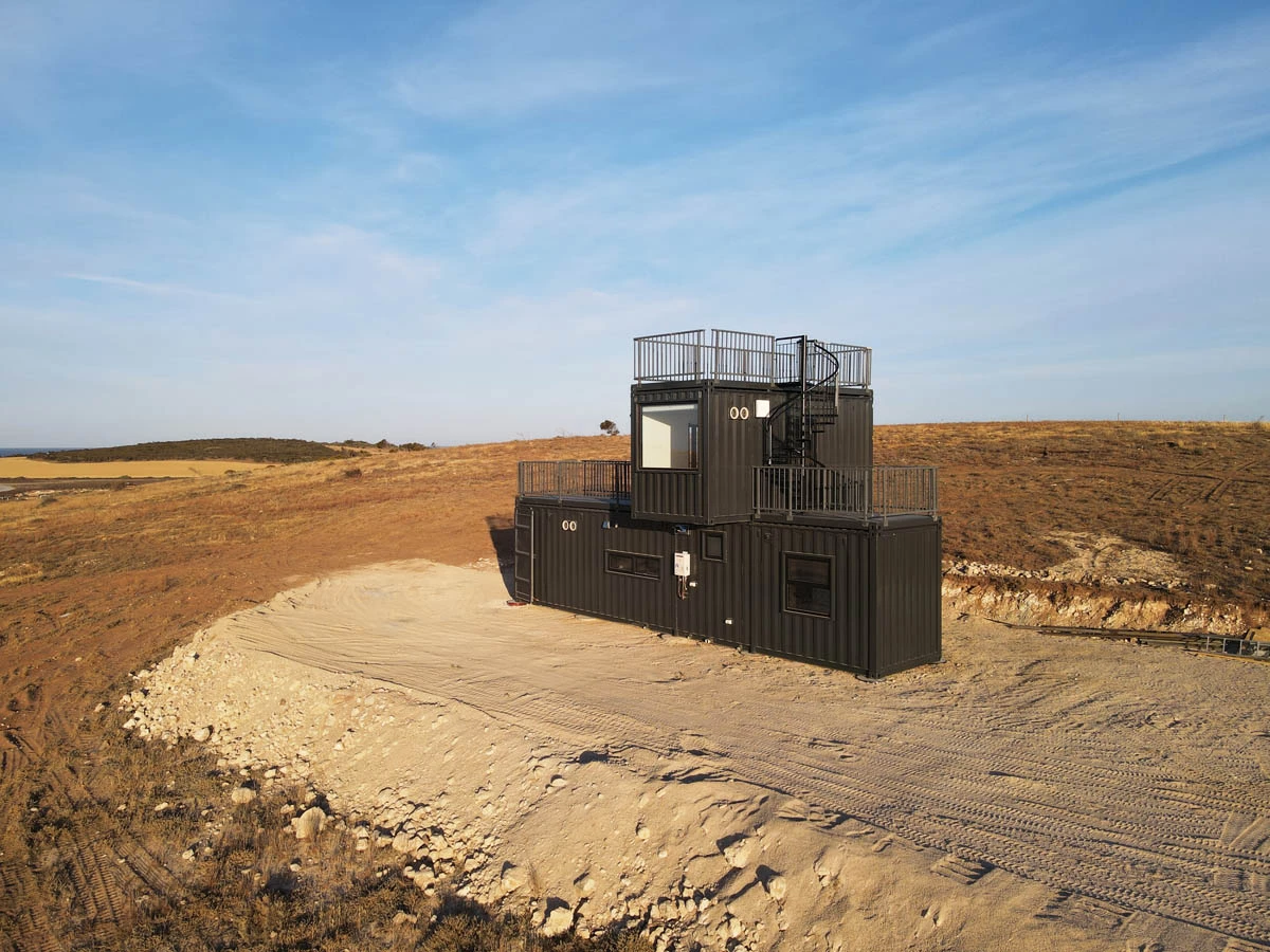 The Mark T is a surprisingly spacious two-story tiny house that's built from three shipping containers