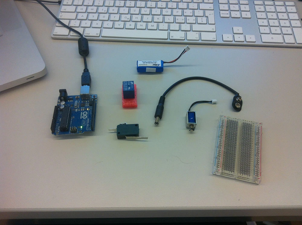 An Arduino-based mechanism attached to a contact switch keeps track of how many times someone sits on it and knocks on the wood each time they get up, indicating the number of uses left