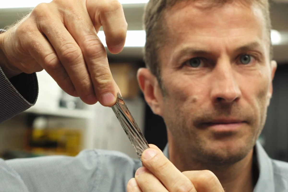 IBM scientist Mark Lantz holding a sample of the new high-density magnetic tape
