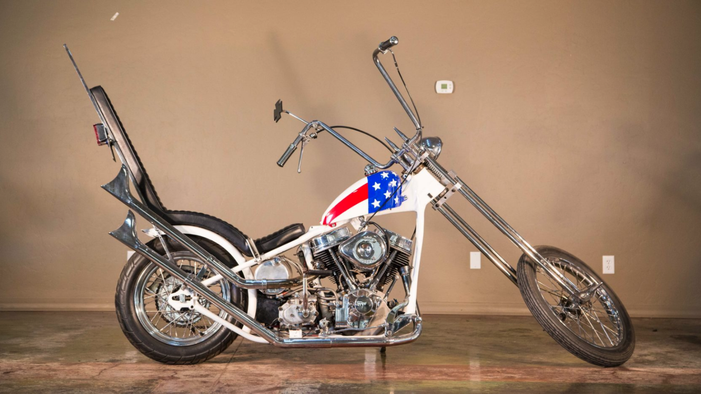 Unless you've been living in a box for the last 50 years, you'll recognize a Captain America Chopper from the 1969 feature film Easyriders. The original, or maybe it wasn't, reportedly sold for $1,620,000, then it didn't, and then maybe it did. We don't know for sure what happened and that's why we report on auction results where the real price can be verified. This replica does the job nearly as well as the original, and cost a lot less than the price the original sold for (or maybe it didn't). At $19,250, which is what this bike sold for, you'll have saved $1.6 million for the journey.