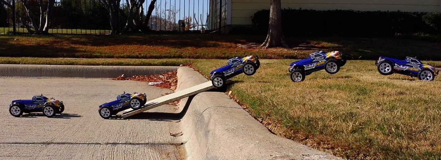 The monster truck's larger wheels are more adept at covering rougher terrain, and its narrow body helps it roll back onto its wheels after a bad tumble