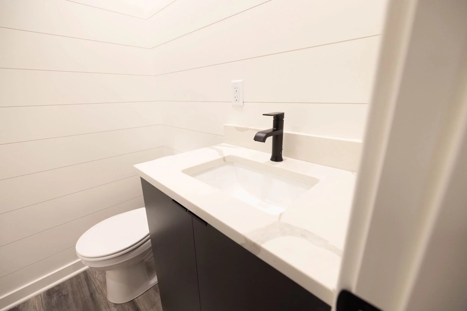 The Nook's bathroom includes a shower, sink, and a flushing toilet