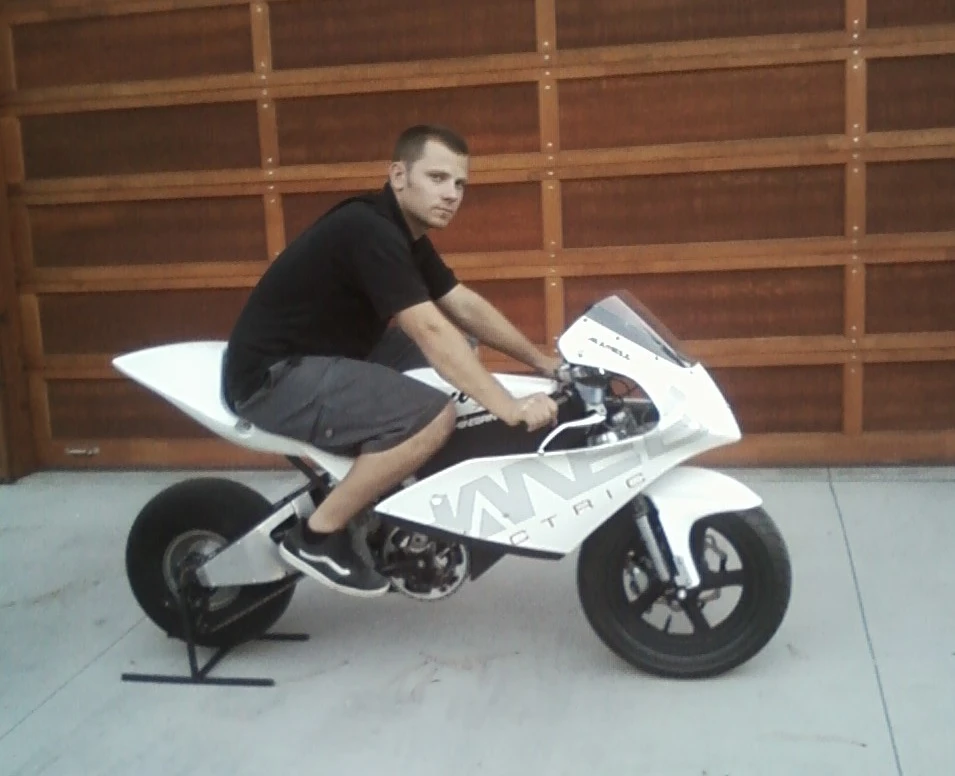 The bike has operable pedals and can be pedaled, with the belly pan of the fairing removed