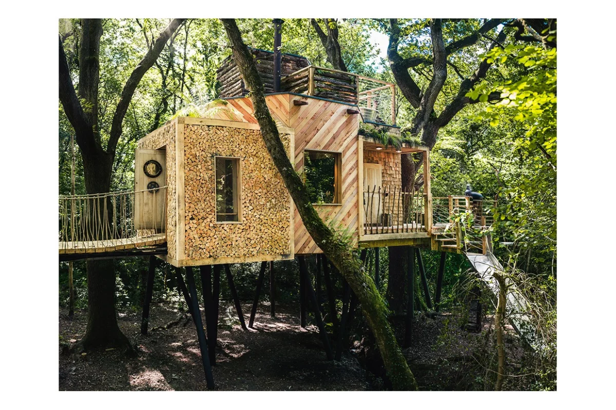 The slide can be seen to the right, there's a hot tub on the roof and access to the Woodsman's Treehouse is gained via an oak door with submarine locking system