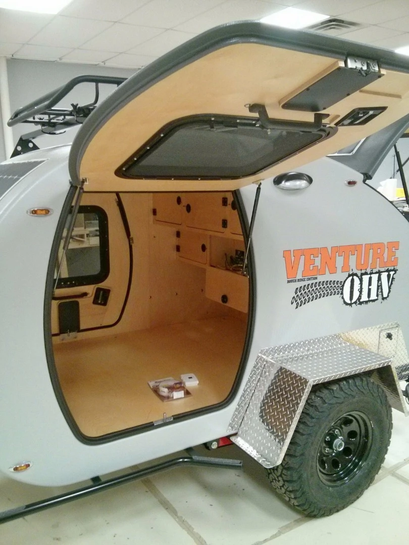 The interior comes with a queen bed, eight cabinets, two shelves, LED lighting and electrical outlets