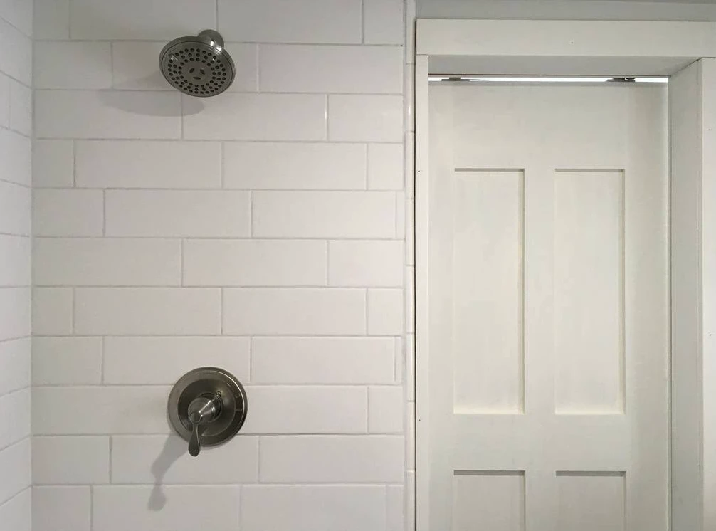 The intellectual Tiny Home's bathroom includes a full-sized shower