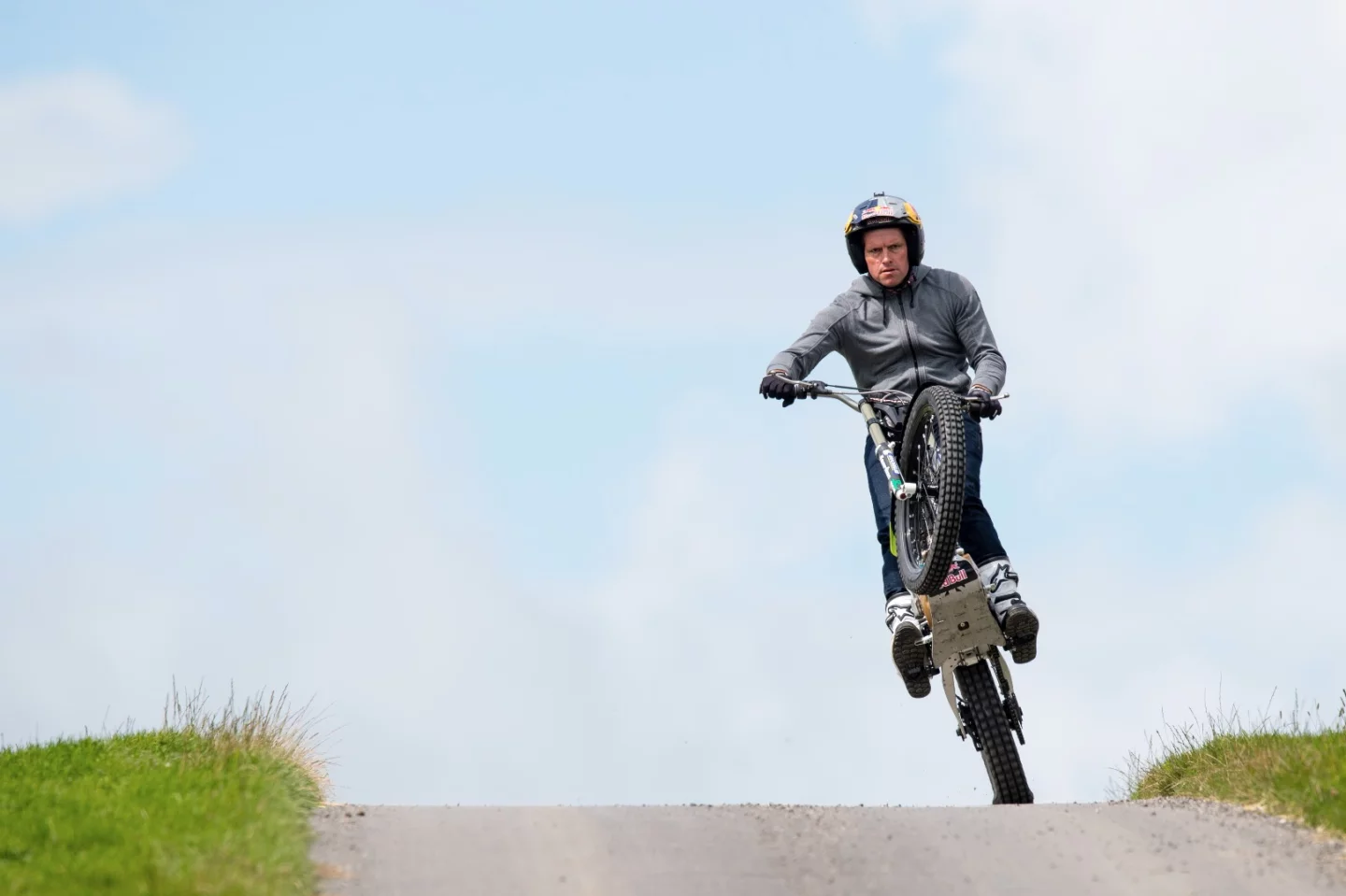 Dougie Lampkin wheelies his lightweight trials bike