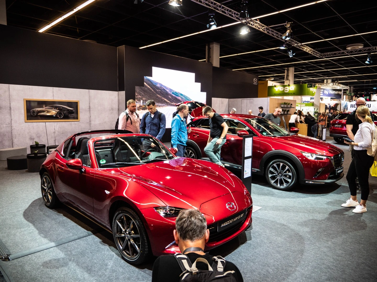 Mazda cheekily stuck some cars in the middle of a camera expo, and the crowd photographed the heck out of them