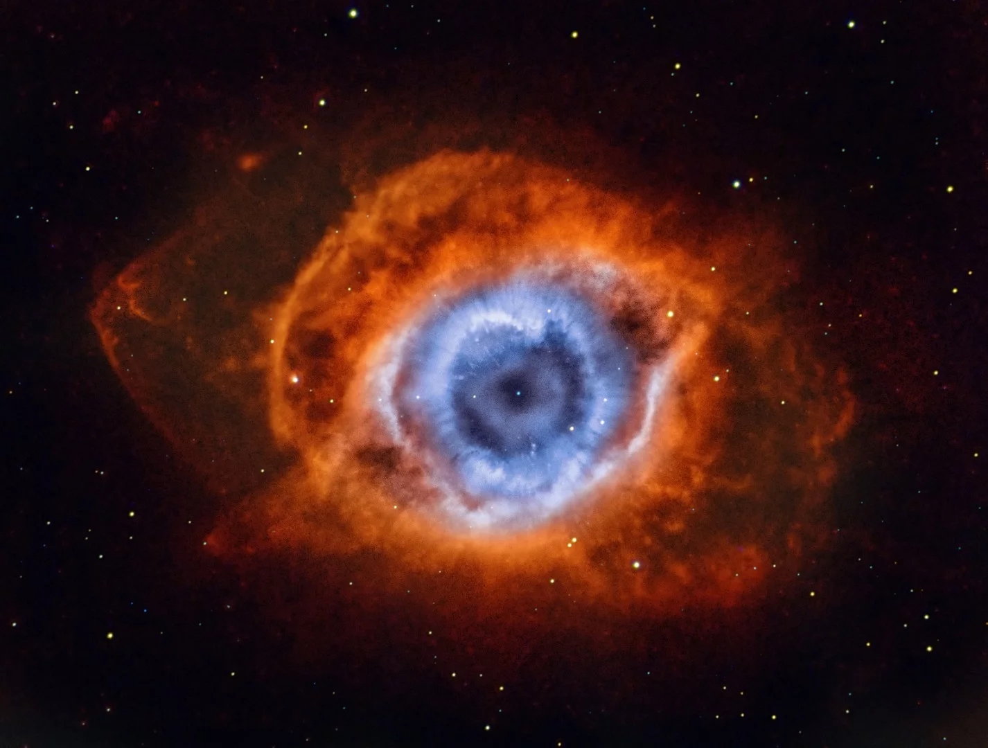NGC 7293, also known as the Helix Nebula is so-named because it appears that you are looking down the axis of a helix. In reality, it is now understood to have a surprisingly complex geometry, including radial filaments and extended outer loops. The Helix Nebula is one of the brightest and closest examples of a planetary nebula, a gas cloud created at the end of the life of a sun-like star. The remnant central stellar core, destined to become a white dwarf star, glows in light so energetic it causes the previously expelled gas to fluoresce. This image is the result of narrowband data on the Helix Nebula, gathered over two months from suburban Melbourne, Australia. The photographer extracted every bit of data to get the outer chevrons and filigree details to separate from the light pollution and wanted to show the OIII eye structures in the iris, so Photoshop masking was used to balance the overwhelming H-alpha signal and let the OIII present well.Melbourne, Australia, 27 November 2018