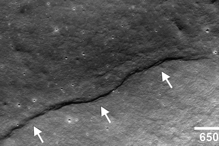 Image showing a thrust fault having pushed crustal materials (arrows) up the side of the farside impact crater named Gregory (Image: NASA/Goddard/Arizona State University/Smithsonian)
